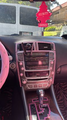 the interior of a car decorated with pink decorations