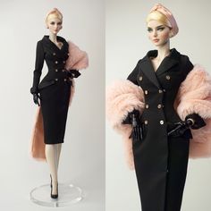 a mannequin wearing a black suit and pink fur stoler with gold buttons