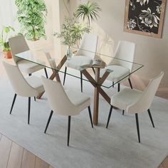 a glass table with white chairs around it