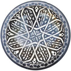 a bowl with an intricate design on it