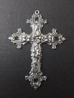 "Large Filigree Cross Pendant Jewelry Finding, Stamping. Measures: 2-1/2\"x 1-3/4\" Finish: Matte silver ox. Sold by the piece. Made in the USA!" Ornate Silver Cross Jewelry, Silver Decorative Jewelry For Anniversary, Thrift Ideas, Pretty Cross, Gothic Pendant, Crown Earrings, Cross Art, Sapphire Rings, Filigree Jewelry