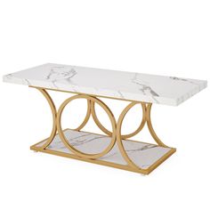 a white marble and gold metal table with two circles on the bottom, one in the middle