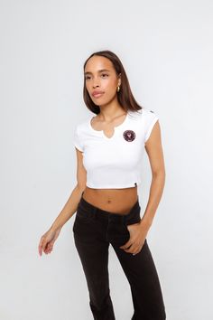 The Cali Tee! A cropped, fitted top with a V-cut front detail at the neckline. Made with fine, ribbed fabric and an embroidered finish. SIZING AND DETAILS Sizing: XS-XXL Cropped fit Form fitting 95% Supima Cotton Rib, 5% Spandex Embroidered logo application P.S. We’d love to see you repping this style! Make sure to tag us (@hypeandvice) to be featured :) Casual Fitted V-neck Cropped T-shirt, Casual Cropped Fitted Crop Top, Casual V-neck Fitted Cropped T-shirt, Fitted V-neck Cropped T-shirt, Fitted White Cropped Top, White Fitted Top With Cropped Hem, White Fitted Crop Top With Cropped Hem, Fitted White Top With Cropped Hem, Fitted Cropped T-shirt