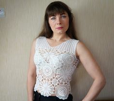 Also you can find other Crochet blouses here: https://www.etsy.com/shop/NataliStudioUA?ref=seller-platform-mcnav&section_id=22291529 Handmade. White crochet top, Lace crochet top, Blouse crocheted, Summer blouser, Cotton blouse, Gift for her. Crocheted blouse crocheted from beautiful and very delicate motifs. Motifs are connected to each other in the process of knitting according to the scheme. This interesting and openwork blouse model will be a great addition or even a highlight in the war White Crochet V-neck Top, Crocheted Blouse, Lace Crochet Top, Crochet Blouses, Fur Pom Pom Keychain, White Crochet Top, Crochet Lace Top, Blouse Models, Hand Knit Hat