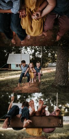 three children are sitting on a swing in the park, and one is playing with his hands