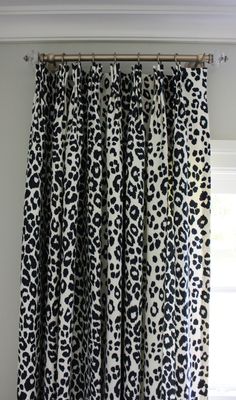 black and white leopard print curtains hanging on a window