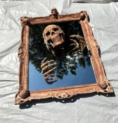 there is a mirror with a skeleton in it