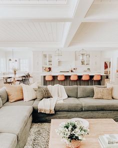 a living room filled with lots of furniture and decor on top of a wooden table