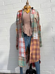 a mannequin is dressed up in plaid clothes