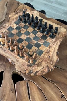 a wooden chess set sitting on top of a table