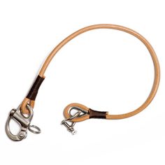 a brown leather leash with metal hooks