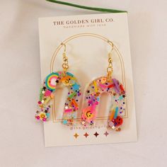 Party Earrings With Ear Wire In Resin, Party Earrings With Resin Ear Wire, Playful Jewelry With Matching Earrings For Party, Multicolor Glitter Drop Earrings, Fun Dangle Earrings For Party, Multicolor Glitter Dangle Earrings, Cute Resin Earrings For Party, Trendy Glitter Earrings For Party, Fun Resin Jewelry For Parties