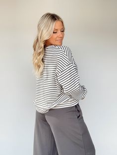 Feel elevated and sophisticated in our Another Coffee Striped Top, a stylish take on a classic design. This timeless striped top features a rounded neckline and a relaxed fit for maximum comfort. Soft and stretchy, it's perfect for lounging or a brunch date. Enjoy versatile style for any occasion, from work to school to errands. Sophisticated, cozy, and chic – you can't go wrong! 58% Cotton 34% Polyester 8% Spandex Hand wash cold. Chic Striped Top With Ribbed Neckline, Chic Striped Tops With Ribbed Neckline, Chic Tops With Striped Sleeves For Day Out, Chic Relaxed Fit Tops With Contrast Stripes, Relaxed Striped Tops For Spring, Relaxed Fit Top With Striped Collar For Fall, Chic Striped Tops For Fall, Relaxed Fit Tops With Striped Collar For Fall, Casual Striped Long Sleeve Top For Fall