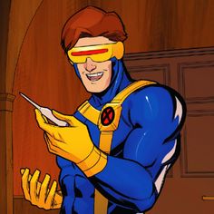 a man in blue and yellow costume holding a knife