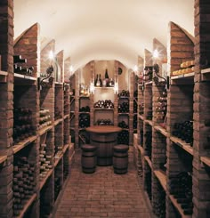 a wine cellar filled with lots of bottles