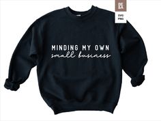 a black sweatshirt with the words minding my own small business printed on it in white