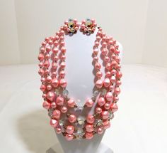 Four Strand Pink Pearl and Aurora Borealis Necklace by KatsCache, $84.95 Pink Pearl Jewelry For Party, Pink Multi-strand Jewelry Gift, Pink Multi-strand Jewelry For Gifts, Pink Round Beads Costume Jewelry, Vintage Pink Pearl Necklaces, Pink Multi-strand Jewelry For Party, Pink Pearl, Aurora Borealis, Lei Necklace