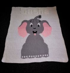 a crocheted baby blanket with an elephant on it's back and the words,