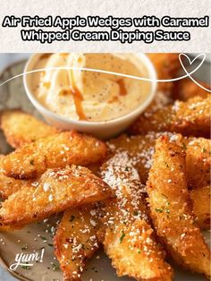 fried apple wedges with caramel whipped cream dipping sauce on the side and text overlay that reads, air fried apple wedges with caramel whipped cream dip