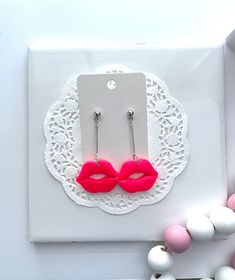 Lip glossy dangles are sure to get noticed! Listing includes: 1 pair of lip dangles. Select a color option during checkout. (Hot pink or red)   Please allow for slight differences in the final product due to different screen resolutions on phones, computers, tablets, etc. Thank you in advance for understanding.  NO RETURNS OR EXCHANGES ACCEPTED AT THIS TIME. Trendy Pink Hypoallergenic Earrings, Trendy Hypoallergenic Pink Earrings, Trendy Pink Dangle Earrings, Modern Pink Dangle Earrings, Jewelry Earrings Dangle, Color Options, Hot Pink, The Selection, Dangle Earrings