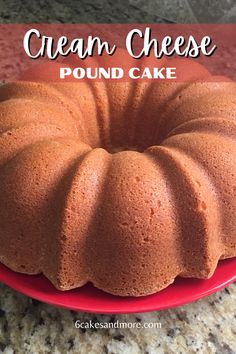 a cake sitting on top of a red plate with the words cream cheese pound cake