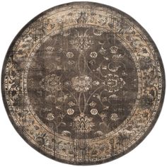 a round area rug with an ornate design on the center and sides in dark brown tones