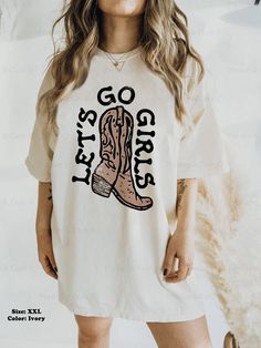 Let's Go Girls! This vintage-style western tee would be perfect for a weekend in Nashville, or for a country music concert! Size up a couple of sizes to make it a t-shirt dress 😊 ⭐️ * I T E M * I N F O* ✦ Comfort Colors Unisex Shirt ✦ 100% Ring-Spun Cotton ✦ Printed using Direct To Garment style- Inks are printed directly into the fabric. ✦ Different sizing may effect placement of final design. ✦ Colors may differ slightly due to different user monitor and screen settings. 📏 * S I Z I N G * ✦ Western Style Oversized Tops For Summer, Oversized Western Style Tops For Summer, Oversized Western Tops For Summer, Retro Fall Rodeo T-shirt, Casual Tops For Country Events In Fall, Fall Graphic Print T-shirt For Country Events, Western Style Relaxed Fit T-shirt For Fall, Graphic Print T-shirt For Summer Country Events, Fall Letter Print T-shirt For Country Concerts