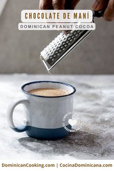 a person pouring chocolate into a cup with a strainer in it and the words, chocolate de manii written below