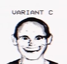 a man with glasses is smiling in front of a sign that says, warrant c