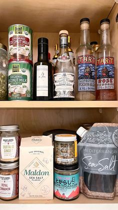 an assortment of spices and condiments on shelves