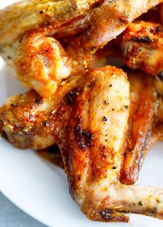 grilled chicken wings on a white plate