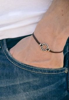 Brown bracelet for men - cord bracelet with a silver tone braided circle charm. The cord is dark brown and made of waxed cotton and the charm is made of alloy. Closure: clasp. The bracelet more... Brown bracelet for men - cord bracelet with a silver tone braided circle charm. The cord is dark brown and made of waxed cotton and the charm is made of alloy. Closure: clasp. The bracelet is 7 1/2 inches long (19cm). This bracelet is great as a gift for a man or a boy. All of our jewelry comes wrapped and ready for gift giving! less... Leather Jewelry For Men, Bracelet For Men Silver, Silver Jewelry Diy, Brown Bracelet, Silver Jewelry Earrings, Discount Jewelry, Mens Leather Bracelet, Cord Bracelet, Bracelet For Men