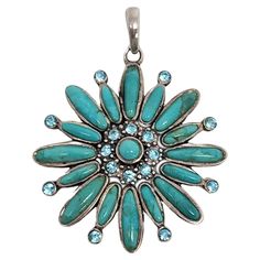 Barse sterling silver turquoise flower pendant This flower shaped pendant features oval bezel set turquoise petals accented with light blue gemstones. Weighs approx 18.8g, 12.1dwt Measures approx 2" long from the top of the bail, 1 1/2" wide. Marked © BARSE 925. Very nice condition with slight surface scratching and light tarnish. Will come packaged in a gift box or pouch (when possible) and will be shipped U.S. Priority Mail Insured. CL120823/17KCS Light Blue Gemstone, Turquoise Flowers, Sterling Silver Flowers, Blue Gemstones, Flower Pendant, Silver Turquoise, Flower Shape, Turquoise Sterling Silver, Bezel Setting