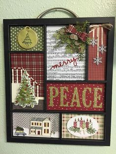 a christmas card board hanging on the wall with holiday decorations and words written in it