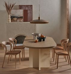 a dining room table with chairs around it