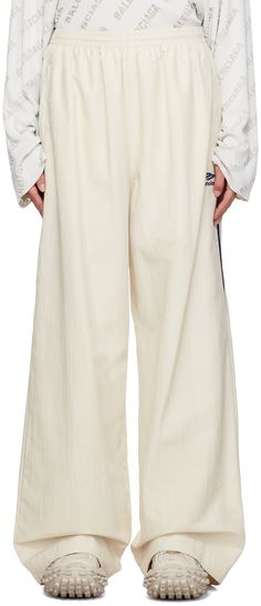 Nylon faille track pants. · Concealed drawstring at elasticized waistband · Two-pocket styling · Logo embroidered at leg · Zip vent at cuffs · Full mesh lining Supplier color: White Track Pants Women, Sport Icon, Sleepwear & Loungewear, Sport Pants, Logo Embroidered, Active Wear For Women, Track Pants, Apparel Accessories, Balenciaga