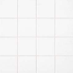 a white tiled wall with no one in it