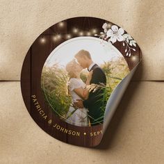 a wedding photo on a wooden plaque with string lights