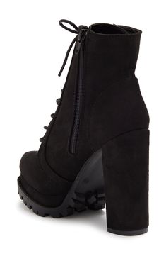 Instantly elevate any outfit with these platform booties featuring a dramatic block heel and lugged sole for trendy style. 4 5/8" heel, 1 1/4" platform 7" shaft height, 9 1/4" opening circumference Almond toe Faux leather upper Lace-up vamp Side zip closure Covered block heel Lug platform sole PU upper/lining, plastic midsole, rubber outsole Imported Trendy High Heel Combat Boots With Lug Sole, Fall High Heel Boots With Lug Sole, Edgy Block Heel Boots With Reinforced Heel, Fall High Heeled Boots With Lug Sole, Fall Combat Boots With Platform And Block Heel, High Heel Platform Boots With Lug Sole For Fall, Fall High Heel Platform Boots With Lug Sole, Fall High Heel Combat Boots With Chunky Platform, High Heel Combat Boots With Lug Sole For Fall