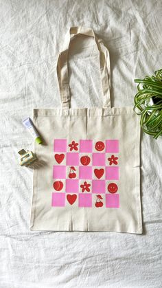 This is a super cute tote bag. This tote is super lightweight and made out of canvas! It is the perfect gift for any occasion. The tote bag is 16" by 15". The handle is 13" long. Totes Painting Ideas, Decorating Tote Bags Ideas, Pink Rectangular Canvas Bag For Weekend, Retro Pink Cotton Bag, Trendy Square Cotton Canvas Bag, Diy Canvas Bag Decorating, Canvas Bag Decorating Ideas, Tote Bag Painting Party