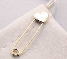 14k Yellow Gold Safety Pin Heart Shape Brooch Handmade in USA Yellow gold safety pin made of solid 14K gold 1.25'' long The jewelry we make is made with recycled and re-refined environmentally responsible precious metals. Please note these pins are not mass produced or cast , each and every one is handmade in our shop with care and great attention to detail. 14K Solid Gold Pin's are made in USA and are of the highest quality. They are nicely polished and stamped for authenticity. Safety Pin Heart, Safety Pin Brooch, Safety Pin Earrings, Brooch Handmade, Heart Pin, Gold Pin, Brooches Handmade, Colour Star, Safety Pin