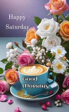 a cup of coffee sitting on top of a saucer next to pink and white flowers