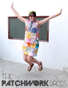 a woman jumping in the air with her arms outstretched