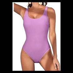 Purple One Piece Swimsuit. Please Read Little Girl Swimsuit. Very Cute For The Beach Or A Pool Very Comfortable. The Colors Are Really Poppin. The Swimsuit Is Adorable. This Is The Sales Price At This Time. I Will Be Changing It When Vacation Season Is Over. It Will Be Priced Back To Its Original Price. No Offer For Less. Not Even If You Put Them In A Bundle They Already Have A Great Sales Price And In Great Condition No Flaws No Tears No Rips No Stain. This Swimsuit Is Timeless. Price $35.00 Si Purple Sleeveless Bodysuit For Vacation, Casual Solid One-piece Swimsuit, Purple Summer Bodysuit For Vacation, Summer Purple Bodysuit For Vacation, Fitted Purple Bodysuit For Vacation, Purple Sleeveless One Piece For Vacation, Sleeveless Purple One Piece For Vacation, Purple Sleeveless One-piece For Vacation, Purple Sleeveless One-piece Beachwear