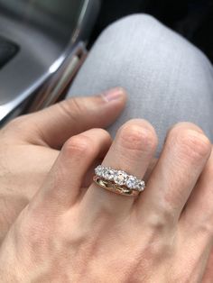 a woman's hand with a ring on her finger