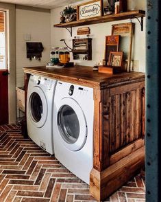 an old washer and dryer are stacked on top of each other in the laundry room