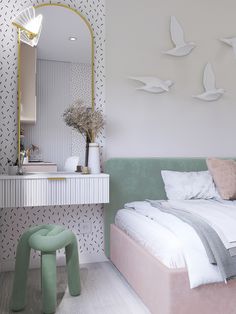 a bedroom with a bed, stool and mirror