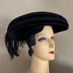 This Is One Of Internationally Famous Designer Eric Javitz's Unique Hats From The 1950s'. The Wide Brim Hat Is Made Of A Firm Structure Covered In Black Felt On The Top Of The Brim, And The Top Of The Crown Is Made Of Velour. There Is A Band Of Velour On The Edge Of The Brim. The Stunning, Large Black Ostrich Feather Really Makes This Hat Stand Out. Label: Eric Javitz It Has Been Said Of Eric Javits That He Does Not Just Design Accessories He Celebrates Women. The Eric Javits Look Is Instantly Recognizable For Its Down To Earth Glamour. His Trademark Is Elegance With Gentility Married To Function. Eric's Use Of Advanced Fibers And His Creative Talent Have Made Hat Wearing Viable For The 21 Cartwheel Hat, Ballerina Workout, Hat Stand, 1980s Design, Design Accessories, Famous Designer, Unique Hats, Hat Stands, Ostrich Feather