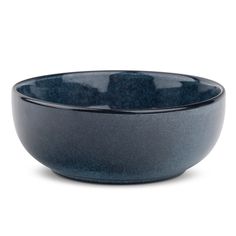 a black bowl sitting on top of a white table