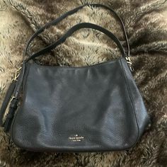 Like New. No Flaws. Zero Call Outs. Exterior & Interior Both Very Clean. Smoke Free Home. Black Colored Inside & Out. Adjustable Crossbody Strap. Shoulder Strap If Preferably Like To Carry That Way. Pebbled Leather. One Zippered Compartment. Another Magnetic Compartment With Additional Smaller Pockets Inside. Very Roomy. Approx Measures 13 Inches Wide & 11 Inches Tall. Silver Hardware. Chic Black Pebbled Leather Hobo Bag, Black Pebbled Leather Evening Shoulder Bag, Kate Spade Leather Hobo Shoulder Bag, Kate Spade Leather Hobo Bag, Kate Spade Textured Leather Shoulder Bag For Evening, Black Pebbled Leather Hobo Bag, Kate Spade Textured Leather Tote Shoulder Bag, Kate Spade Textured Leather Satchel Shoulder Bag, Kate Spade Textured Leather Crossbody Bag